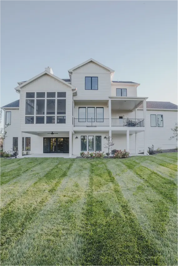 white house with large windows and balcony